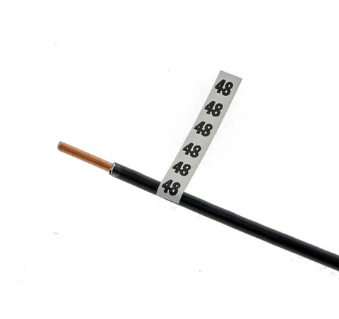 Pro Grade Wire Marker Booklet 0 To 48 Labels 10 Pack shown on black cable