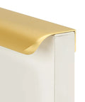 Close-up of 10 Pack 7 1/2 Inch Matte Gold Finger Pulls For Cabinets And Drawers showing brushed brass edge on white cabinet corner.