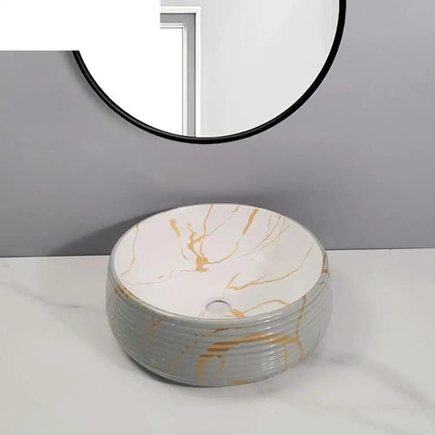 Bathroom Sink Bathroom Vessel Sink Round Art Basin Home Ceramic Wash Basin with gold accents and a circular design