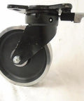 Heavy Duty 8 Inch Forged Steel Dual Wheel Caster Set With Kingpinless Swivel Directional Lock and Rigid Rollers, close-up angle.