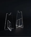 Lightweight Portable Bicycle Stand For Parking And Display shown in clear acrylic, suitable for road, mountain, and folding bikes.