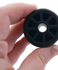 Close-up of Refrigerator Rear Caster Wheel Replacement For DA61-04703A 2033808 Black One And A Half Inch Diameter By One Inch Wide