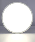 Ultra Slim 15.7 Inch LED Flush Mount Ceiling Light Fixture 5000K Daylight White, glowing round design on a white surface.