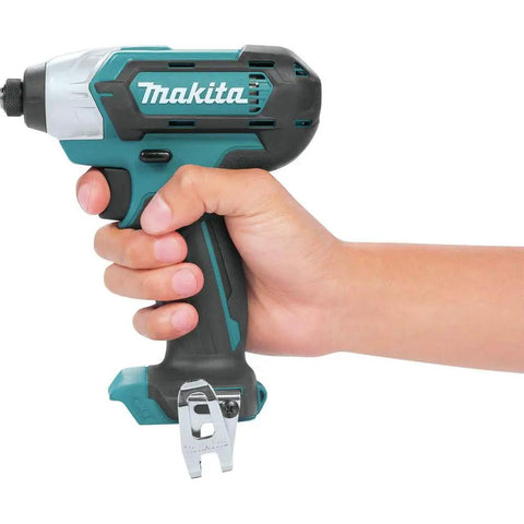 Hand holding Makita lightweight 12V max cordless impact driver from the combo kit, showing compact 7 inch design and build.
