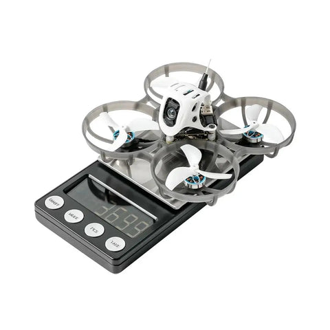 65 Pro Drone Frame With 66mm Wheelbase, 3in1 HD Flight Controller on digital scale, featuring 0802SE Motors, PP composite frame
