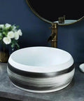 Bathroom Sinks Indoor Countertop Ceramic Basin Outdoor Countertop Washbasin Bathroom Basin Wash Basin Vessel Vanity Sink Bowl Basin in white and black design on gray countertop.