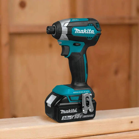 18V Brushless Cordless Impact Driver Kit XDT131 With 3.0Ah Battery resting on wooden surface in workshop setting.