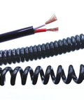 Heavy Duty Coiled Extension Cord That Snaps Back Quick Stretches Twelve Feet For Truck Beds And Workshops Delivers Reliable Three Core Power showing coiled design and inner wires.