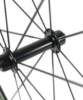 Close-up of R13 hub and spokes on Carbon Fiber Road Wheelset Clincher 50mm Depth With R13 Hub Decal For Zippy Aero Ride Shimano 8 9 10 11 Speed Compatible Basalt Braking Surface V Brake Ready Road Rims Toray T700 Construction 2 Year Warranty
