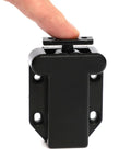 Push To Open Cabinet Latch With Touch Release, black finish, shown with finger pressing touch feature, minimalist hardware.