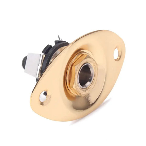 Top Notch Metal Oval Electric Guitar Jack Plate With Included Screws Fits Fender Strat And Tele Models For Super Crisp Tone And Hella Reliable Signal Transfer In Classic Gold angled view showing input hole and mounting features.