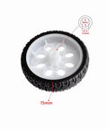 Close-up of a single white and black tire from Four 65mm Rubber RC Wheel Set For DIY Models, Robots, and Small RC Cars, 15mm thick.