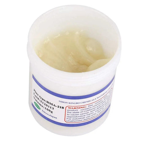 Open container of RMA 218 Flux Paste For BGA Reballing And Soldering, visible paste texture, clear plastic packaging, 100g.