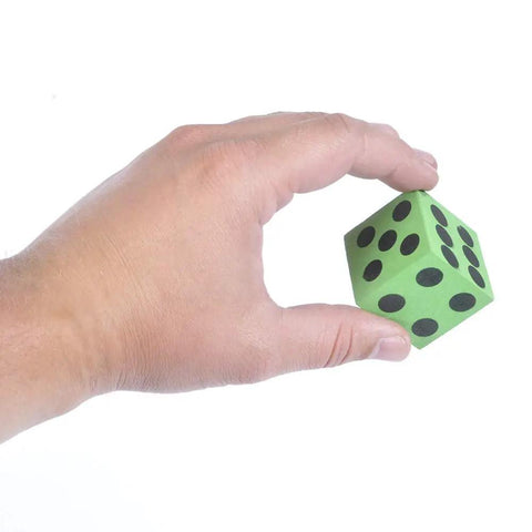 Hand holding green foam dice with number dots from Bulk Pack Of 36 1.5 Inch Foam Dice In Assorted Colors For Kids And Classrooms Big Fun Durable