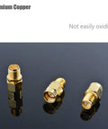 4 Pack SMA Male To RP SMA Female Adapter Connectors For RF Coax Cables, copper adapters on reflective surface