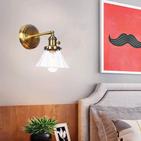 Straight Up Stunning Nordic Metal Wall Sconce With Adjustable Hand Blown Glass Shade And No Fuss Switch E27 One Light Wall Lamp for Bedroom or Dining Room Setting, brass finish and clear shade.