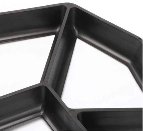 Close-up of black 30x30 cm paving mold, part of Two Pack Concrete Slab Moulds For DIY Path Building Irregular Stone Look Pavement Bricks 30x30 Cm.