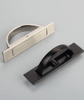 Two zinc alloy cabinet door pull handles with rotatable hidden rings in brushed and black finishes for dressers and wardrobes.