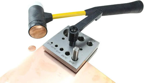 Eight Piece Disc Cutter Set For Heavy Duty Circle Cutting One Eighth To One Inch Punches Lever Clamp on metal sheet with mallet