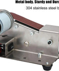 Stainless Steel Electric Belt Sander Grinder Machine With Adjustable Work Table Shockproof Feet For Abrasive Polishing Knife Making DIY Projects Versatile Desktop Polishing Tool close-up of metal body and motor.