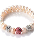 Pearl bracelet with crystal rhinestone disco ball beads and pink centerpiece
