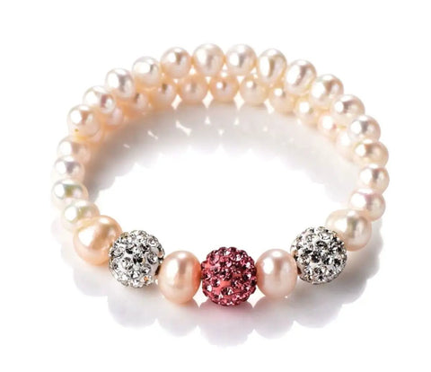 Pearl bracelet with crystal rhinestone disco ball beads and pink centerpiece