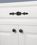 Vintage Style Zinc Alloy Pull Handle For Cabinets And Drawers Black 4 Pack With Screws Fits 18mm Thick Wood Ideal For Drawer Cabinet Furniture Remodel And Home Upgrades installed on white cabinet