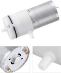 Front view of micro air pump, DC 12V; white plastic front with drive shaft and metal motor housing.