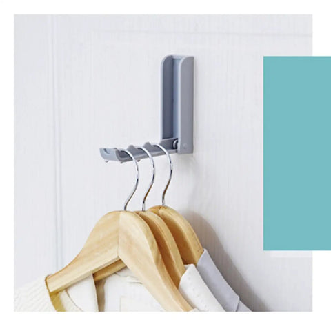 Slick Foldable Wall Hooks With Adhesive Backing For Space Saving No Drill Setup To Hang Jackets Purses Hats Or Dog Leashes In Foyer Closet Easy Install Design Works As A Lifesaver To Keep Home Clutter Free Always Two Pack with gray hooks holding wooden hangers.