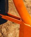 Close-up of 3 point subsoiler with pipe layer for Cat 1 tractors, accepting 50mm poly pipe, in use on compact soil