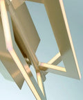 Close-up of the Slick Modern Wall Sconce With Asymmetrical Fan Frame LED Light Featuring Water Mill Inspired Gold Finish.
