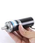 Hand holding Beefy 12V 24V Planetary Gear Motor With All Metal Gearbox And Bracket Tiny Yet Mighty DC Electric Motor 98 RPM