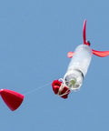 Screw On Water Rocket Fins With Parachute Kit For 2 Liter Bottles Fits 95 Percent Of Launchers No Tools Required Easy Screw On Assembly Includes 24 Inch Red Ripstop Parachute Ready To Fly in flight with red fins and parachute deployment.