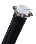 Top Grade E85 Ready Nylon Braided PTFE Fuel Line Kit With Swivel Hose Ends In An6 An8 And An10 Sizes For Hot Rigs And Street Racer Builds Featuring Long 10ft Length In Durable Black Finish To Upgrade Your Ride Today. black braided PTFE fuel line cross-section with white inner liner