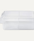 Side view of a clear plastic organizer bin with compartments for sorting small parts, ideal for office or craft use.