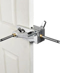 Two And One Eighth Inch Carbide Tipped Multi Spur Bit attached to a door for precise hole cutting with half inch shank visible.