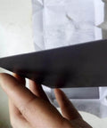 High Purity 99.9 Percent Carbon Graphite Plates For Metallurgy And Lab Use, 30Mm By 20Mm By 2Mm in hand, side view