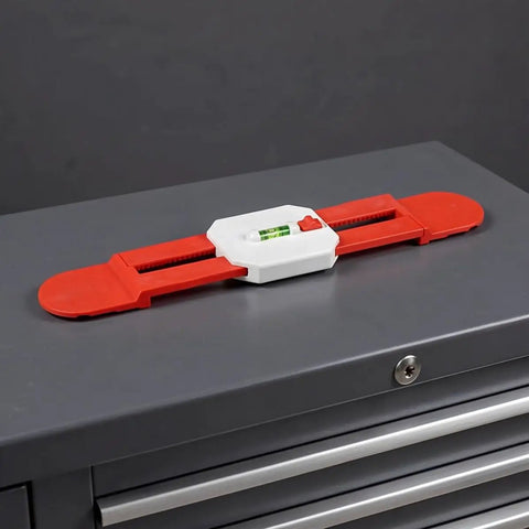 Adjustable Telescopic Spirit Level Ruler for Ac Installation, Red displayed on a tool cabinet with measuring bubble.
