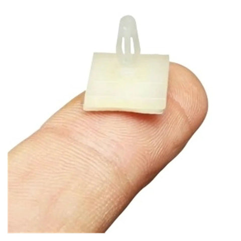 Hella Secure Self Adhesive PCB Snap Fasteners Featuring Slick Flat Head Design Skip Pre Drilling Easy Mounting For Electronics Projects Rock Solid Hold Heavy Duty 100 Pack on a fingertip for scale.