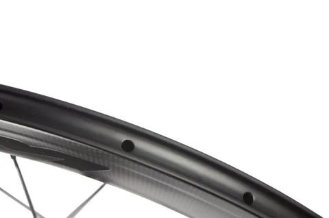 Close-up of 50mm Carbon Disc Brake Road Wheelset 700c Clincher 3K Matte Finish Lightweight rim with spoke holes