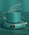 Electric Coffee Mug Warmer For Desk Keep Those Sips Straight Up Piping Hot With This Zero Fuss Plate Heater For Coffee Tea Cocoa Milk And Soup In Bold Red Or Green, featuring a teal mug with splashing water and a digital display.