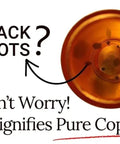 Image of a copper pot base with black spots and text highlighting purity of copper.