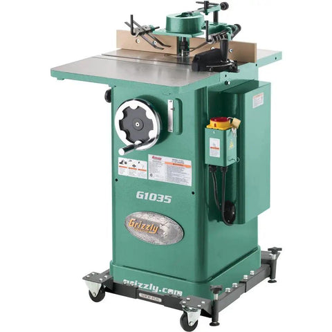 Built Like A Tank One Point Five Horsepower Woodworking Shaper Featuring Massive Twenty By Eighteen Inch Cast Iron Table And Dual Voltage Motor, side view.