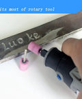 Using a 20 Piece Rotary Grinding Stone Bits Set With One Eighth Inch Shank to engrave metal, pink abrasive mounted stone