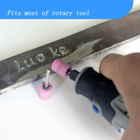 Using a 20 Piece Rotary Grinding Stone Bits Set With One Eighth Inch Shank to engrave metal, pink abrasive mounted stone