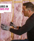 Man installing Unfaced R21 Fiberglass Insulation Batts Configured For 2X6 Walls for thermal efficiency.