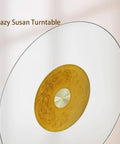 Super Spacious 40 Inch Lazy Susan Turntable For Kitchen Tables Crafted From Tough Tempered Glass with a golden centerpiece.