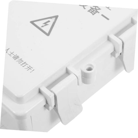 Close-up of a heavy duty white waterproof plastic electrical junction box for wiring security cameras and electronic components with UV resistance for outdoor commercial use.
