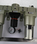 Three Quarter Inch Air Filter Regulator Lubricator All In One FRL Combo For AC5000 Series Modular SMC Type on table with ruler