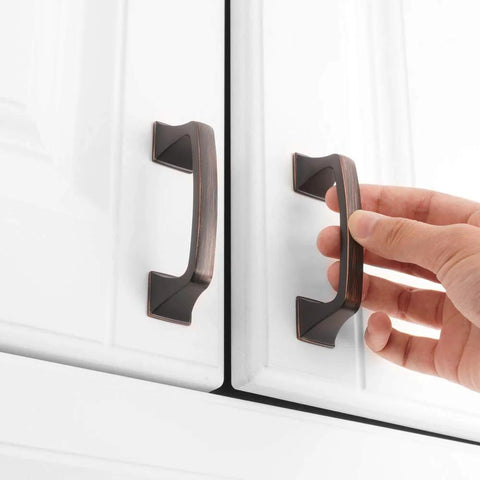 Hand installing oil rubbed bronze square arch pull on white cabinet with 3 inch spacing, 10 pack, 76mm